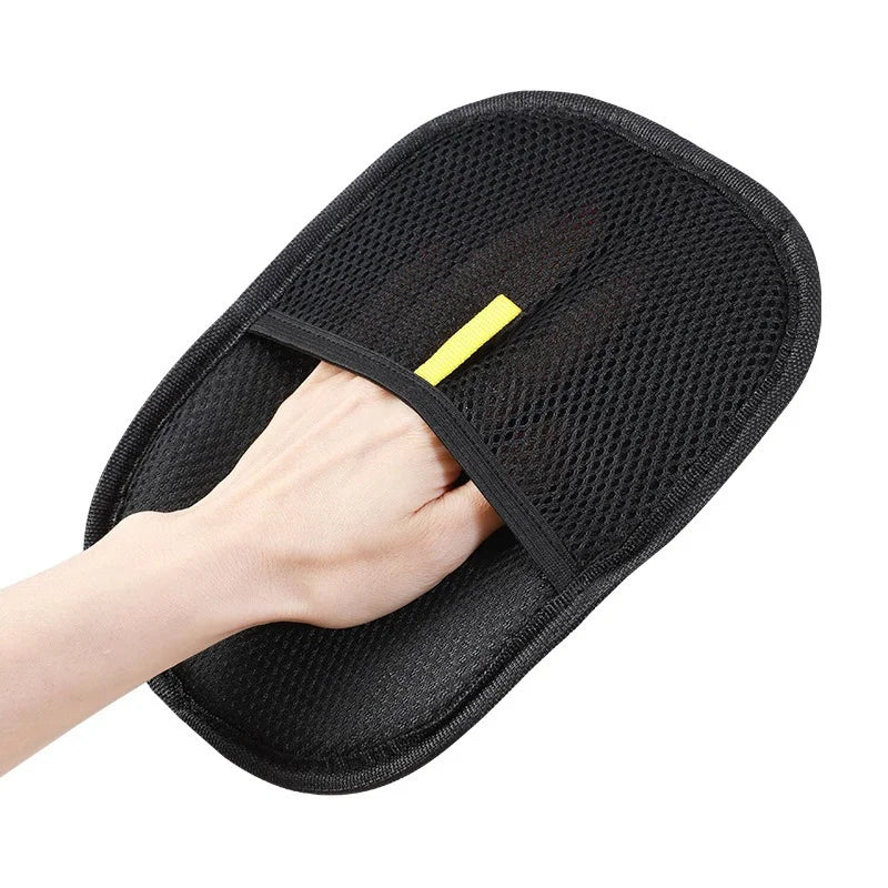 Pet hair glove worn on a hand
